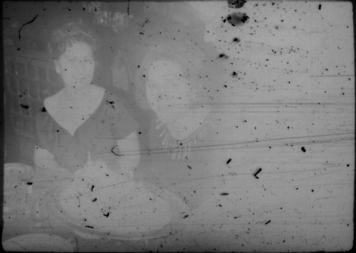 Alice Peters and unidentified woman in restaurant