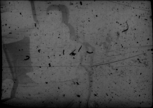 Unidentified person sitting on a couch (Peters relative?)