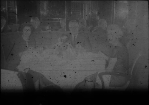 Alice Peters and others gathered around a table