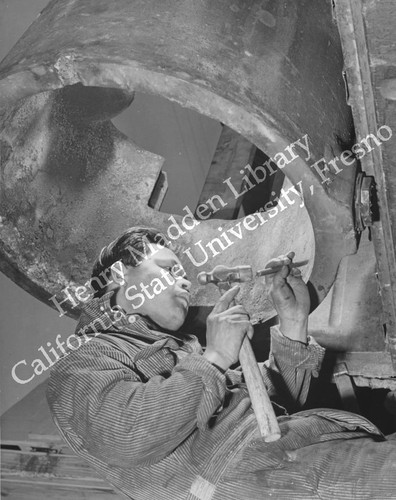 Former California plumber Morio Higashi marking out a steel casing for welding at Rohwer Relocation Center