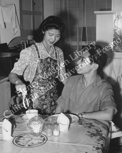 Mr. and Mrs. George Amano having breakfast in their apartment in Detroit, MI