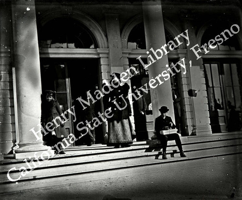 Fashionable lady in front of Public Comfort Building