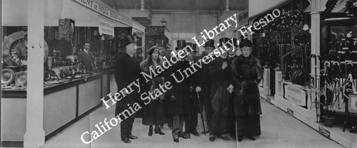 Fair goers posed in front of India Board of Industry display