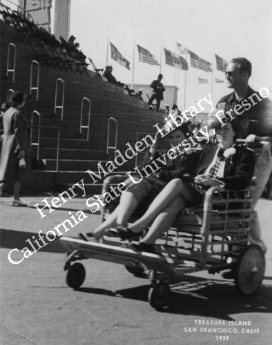 Two women sitting in push cart