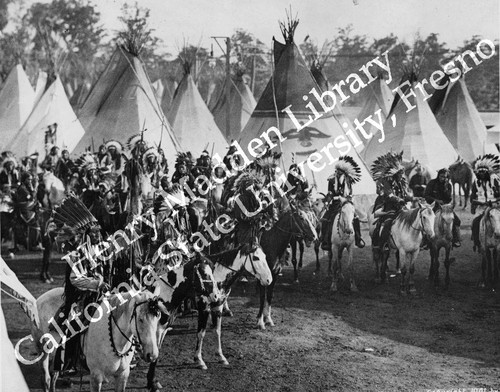 Indian men and women on horseback