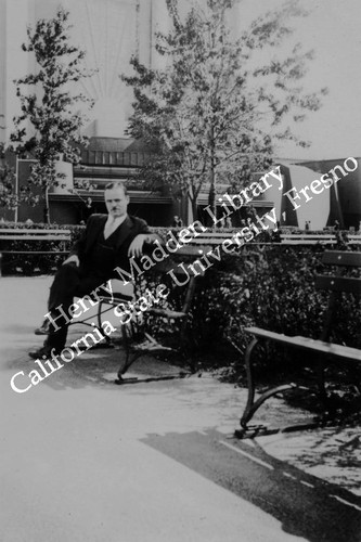 Fairgoer in front of unidentified building