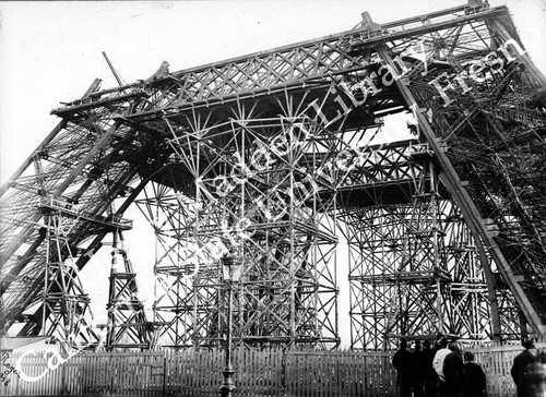 Side view of base of Eiffel Tower under construction