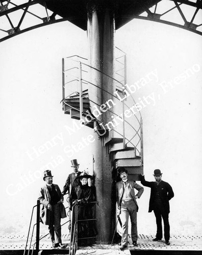 M. Eiffel and others standing on Eiffel Tower