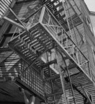 [Fire escape on clapboard building]