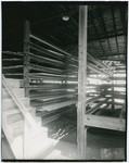 [Belts and lumber planks inside Setzer Box Co. building, 2570-2610 3rd Street, Sacramento]