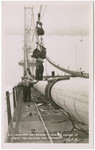 S.F. Oakland Bay Bridge, placing collar on cable for holding the stringers