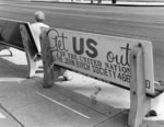 [John Birch Society advertisement on bus bench]