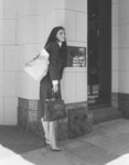 [Woman outside bank]