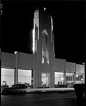 [Exterior night shot full front view Howard Motor Company building, 4th and Western, Los Angeles]
