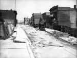 [Subsidence of street and sidewalk. Dore St.]