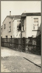 [Back of San Francisco house with lattice fence and door]