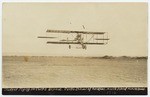 Student flying in Curtiss Biplane