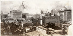 [View of fire looking southeast from Nob Hill. Spires of California Hotel and Theatre, right]