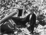 [Boy and man among rubble. Unidentified location] (3 views)