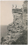 [Two men doing a handstand on cliff edge in Yosemite]