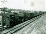 [Southern Pacific locomotive 4164 (533) pulling freight cars]