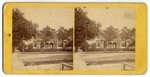 [View of house on tree lined street]