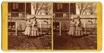 [Two young women standing in front yard of house]