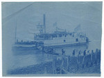 [Passengers disembarking paddle wheel steamer, "Caroline".