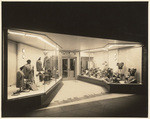 [Exterior night shot display window general view Tate Puls Clothing Store, 6525 Pacific Boulevard, Huntington Park, Los Angeles]