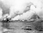 [View of city burning from San Francisco Bay. Ferry Building, right]