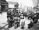 [Street scene. Relief line at wagon? Mission St.?]