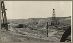 [Oil well and dirt roads nearby]