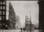 [View of ruins and rubble along Montgomery St. Looking south from California St.]