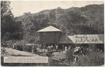 Mid-winter scene of eastern tourists at Bungalow Inn, in Bungalow Land, Laurel Canyon, near Hollywood, California and, showing water tank 500 feet up mountain side in rear of the Inn