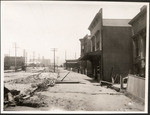 [Earthquake damage along unidentified street]