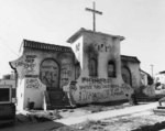 [Abandoned stucco church]