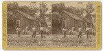 [Men standing in garden near building in Monterey]