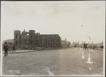 [Street scene at Van Ness Ave near Market St. Ruins of St. Ignatius Church and College, left]