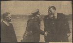 Here was scene at Bolling field, Washington, as Col. Lindbergh, with a cheerful grin, shook the hand of Maj. Fitzmaurice while Capt. Koehl (at left) looked on