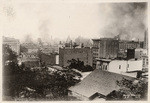 [View of city burning, looking southeast from Nob Hill. Mills Building, left; California Hotel and Theatre, right] (2 views)