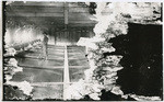 [Man with broom working on mercury plates in mine building]