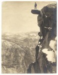 [Galen Clark poses on Glacier Point's Overhanging Rock]