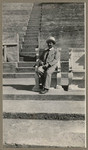 [Man sitting in chair at Greek Theatre in Berkeley]