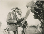 Ernie Smith standing beside the "City of Oakland" which he flew to Hawaii in the Dole Race in summer of 1928