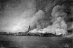 [View of city burning from San Francisco Bay, Ferry Building in center]