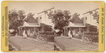 [Woman and girl sitting next to building in Stockton]