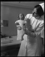 Infant incubator display - Nurse holding infant