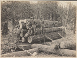 [Loggers on railroad flatcar]