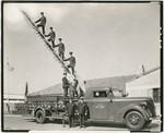 [Fire truck and firemen in front of Truck Co. No. 2 fire station, 3145 Granada Way, Sacramento]