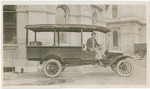 Second State Library truck, Albert A. Oughton, driver. Rear view of State Library quarters in State Capitol